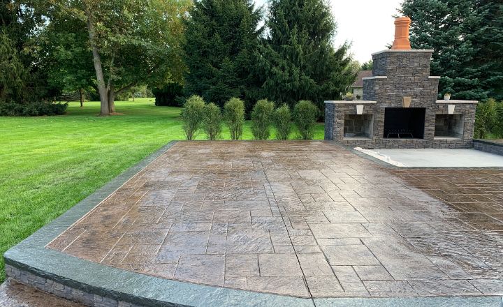 A patio with a decorative concrete